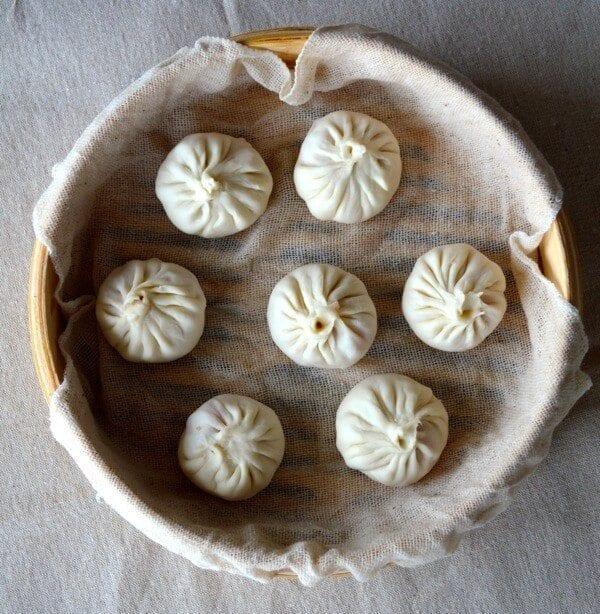 Raw Soup Dumplings in steamer, by thewoksoflife.com